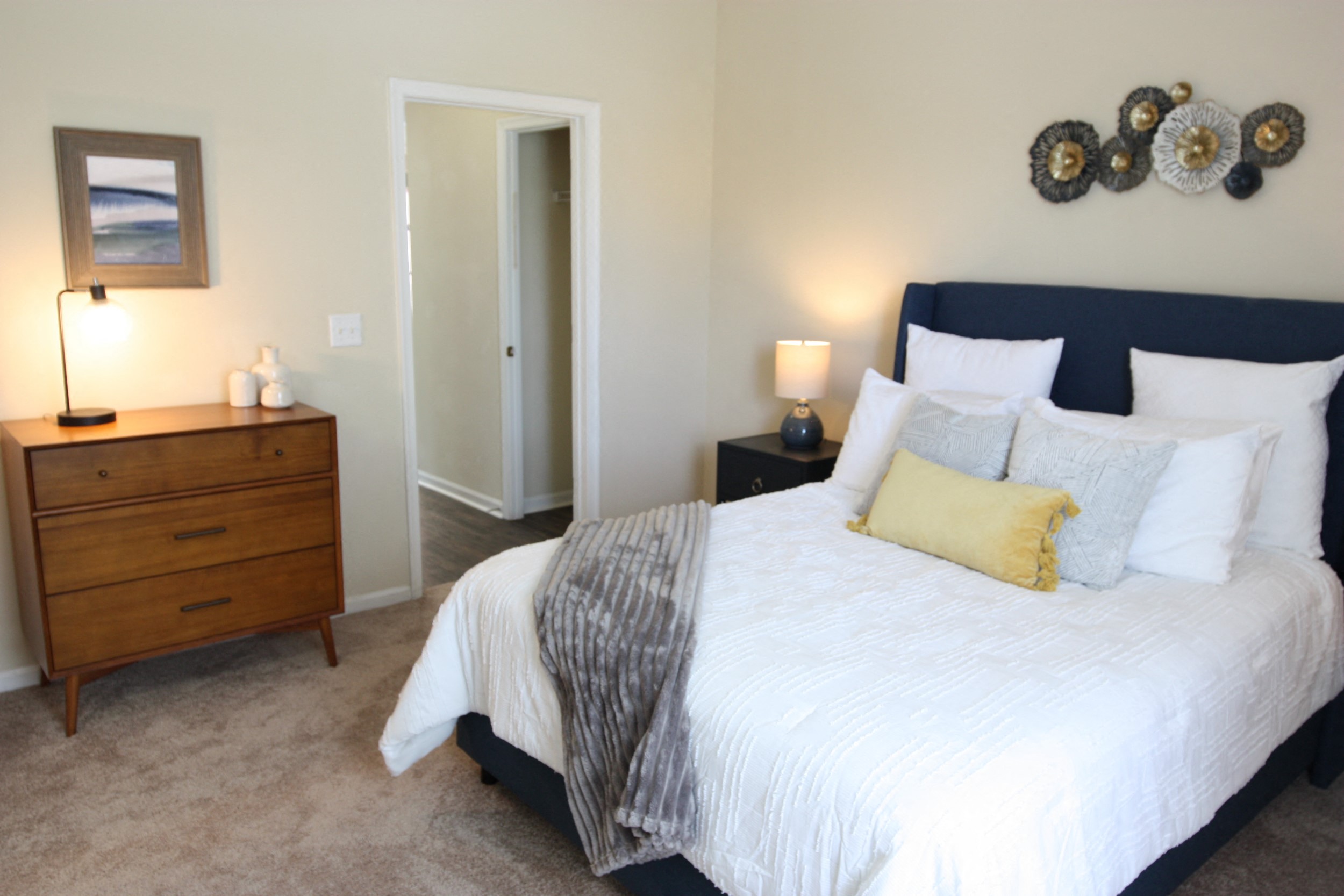 View of the bedroom in the model home at Harbour Breeze Apartments in Suffolk Virginia