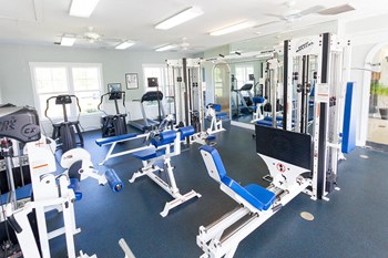 24-Hour Fitness Center with cardio, resistance and tredmill equipment Inside the fitness center at Harbour Breeze Apartments