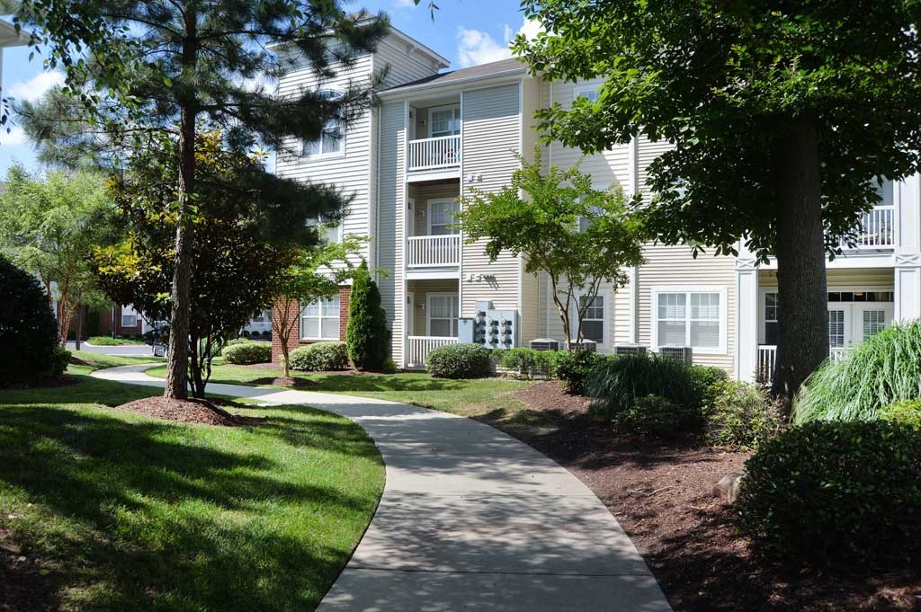 walking path detail image with shade trees at 700 Acqua