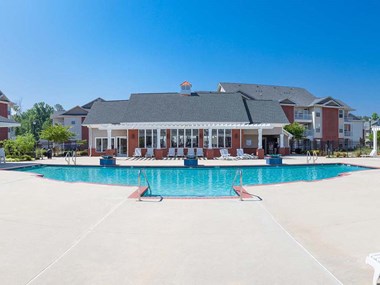 outdoor sun deck and pool behind the clubhouse