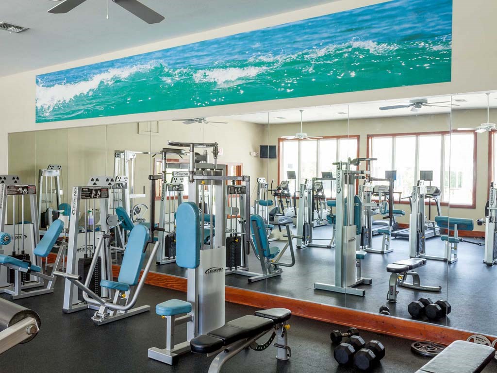 interior fitness center with resistance machines and free weights