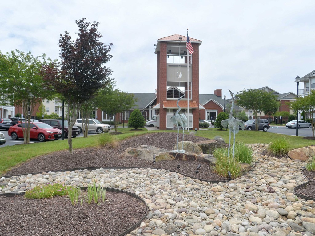 beautifully landscaped entrance to 1200 Acqua Luxury Lifestyle Apartments in Petersburg Virginia near Fort Lee