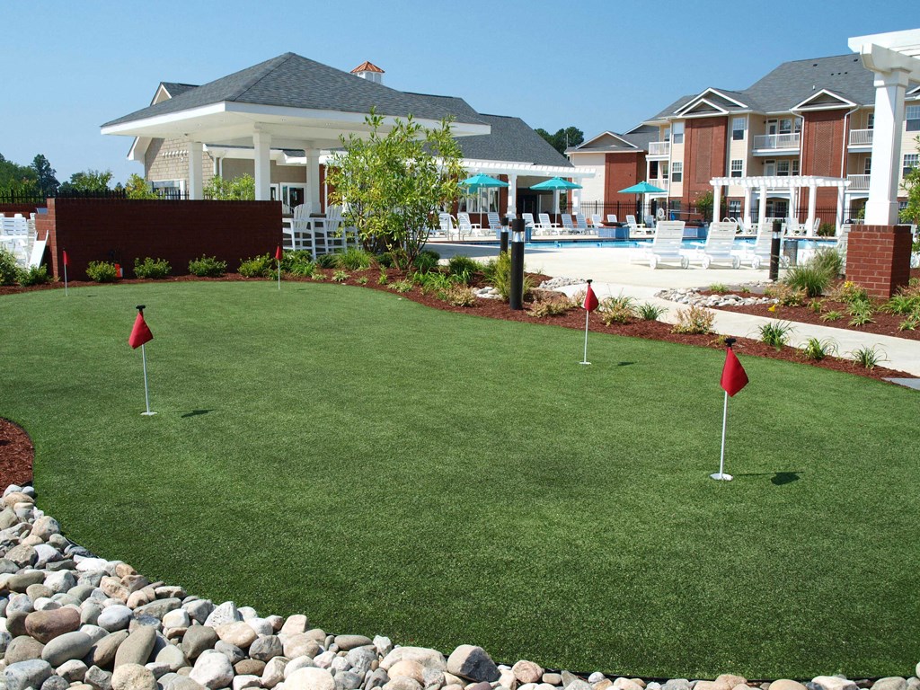 outdoor putting green for enterainment and recreation at 1200 Acqua Apartment homes