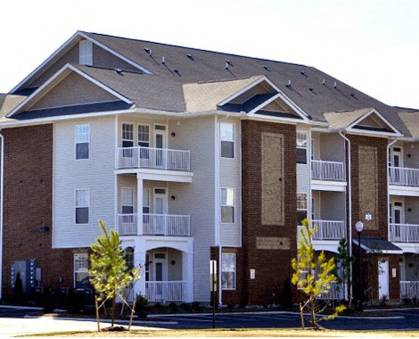 an apartment building on the side of a street
