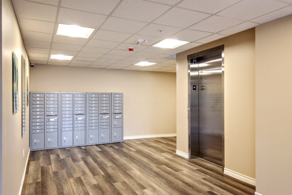 a view of a room with lockers and a door