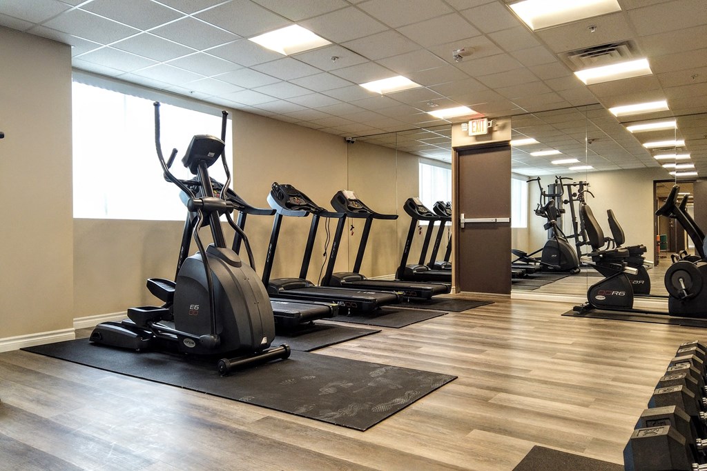 a gym with cardio machines and other exercise equipment