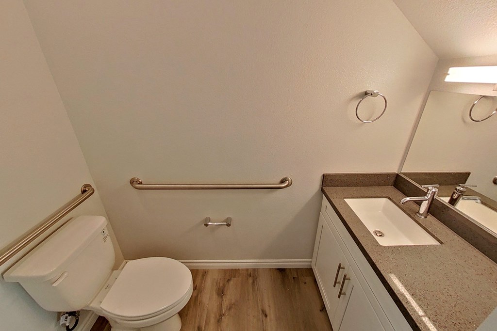 an empty bathroom with a toilet and a sink