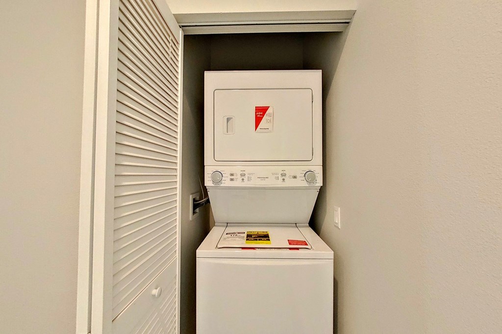 the laundry room has a washer and dryer in it