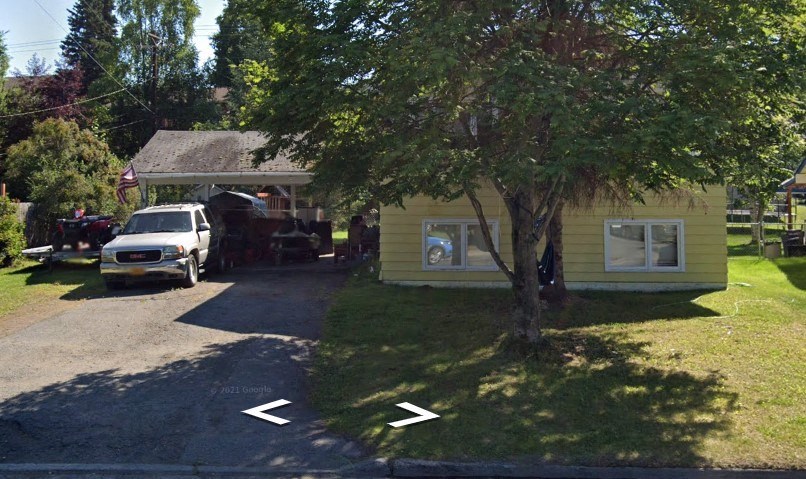 a house with a car parked in front of it