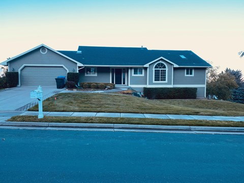 A house with a blue sky in the background.