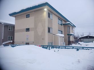 a building with snow in front of it