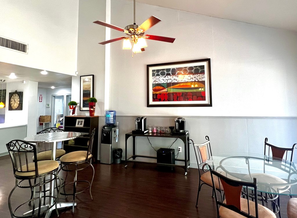 a dining room and living room with a table and chairs