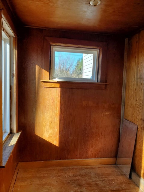the inside of a tiny house with a window