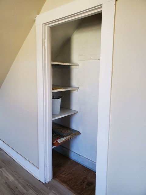 the pantry under the stairs in the attic is empty