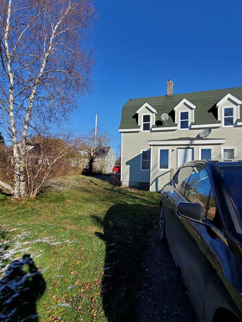 a car parked in front of a house