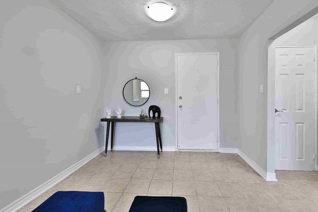 A room with a table and two chairs.