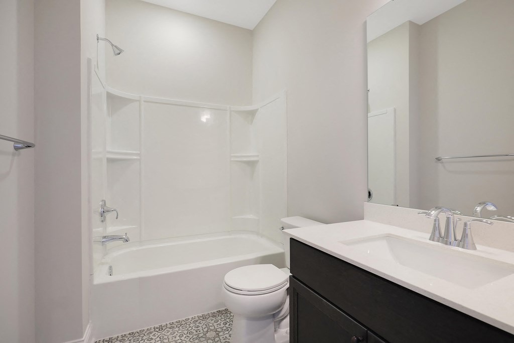 a bathroom with a sink toilet and a shower