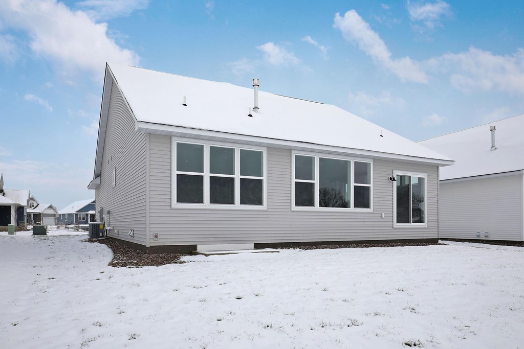 the front of the house with snow on the ground