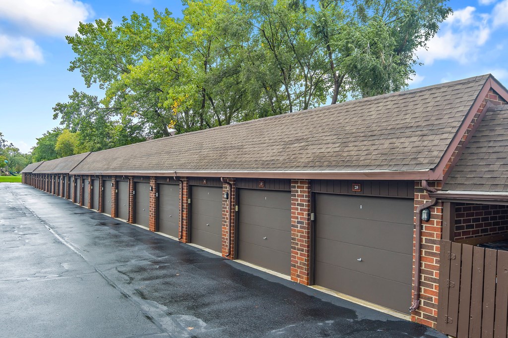the carriage house has a long row of garage doors