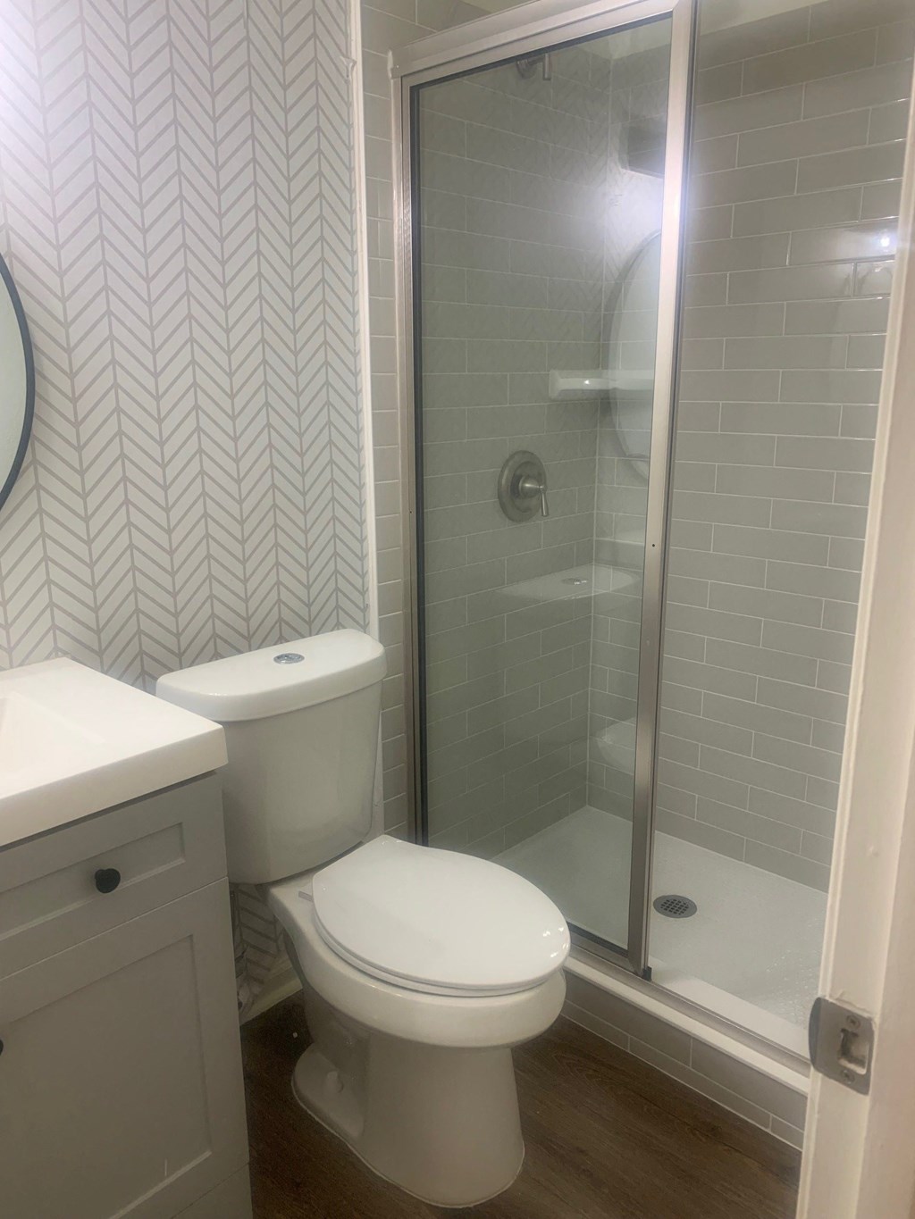 a small bathroom with a toilet and a shower