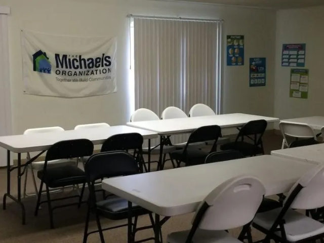 a group of tables and chairs in a room