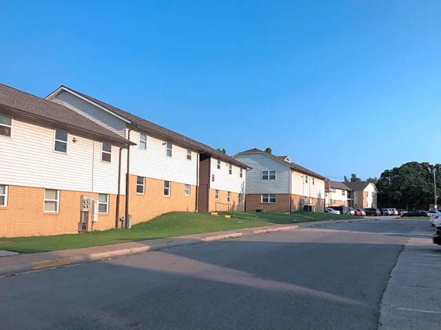 a row of houses on the side of a street