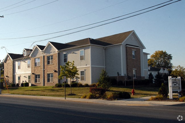 a row of houses on the side of a street