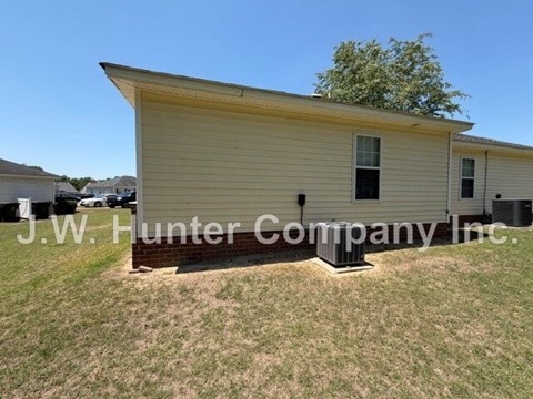 A small yellow building with J.W. Hunter Company Inc written on it.