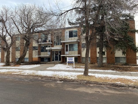 our apartments are located in a building with trees