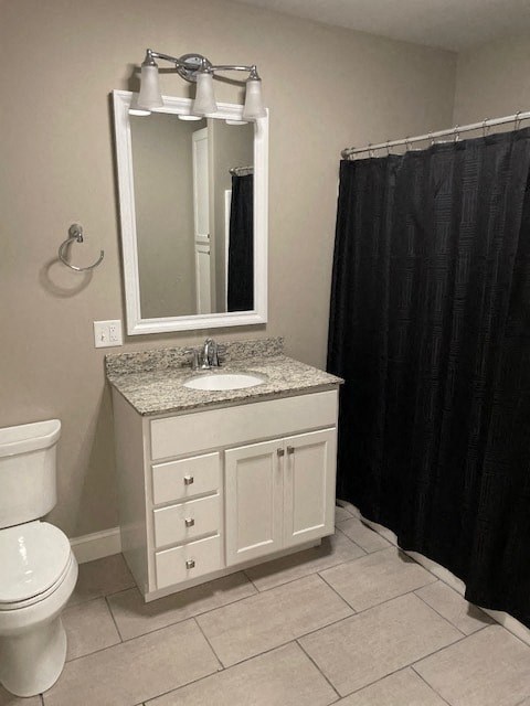 a bathroom with a toilet and a sink and a mirror