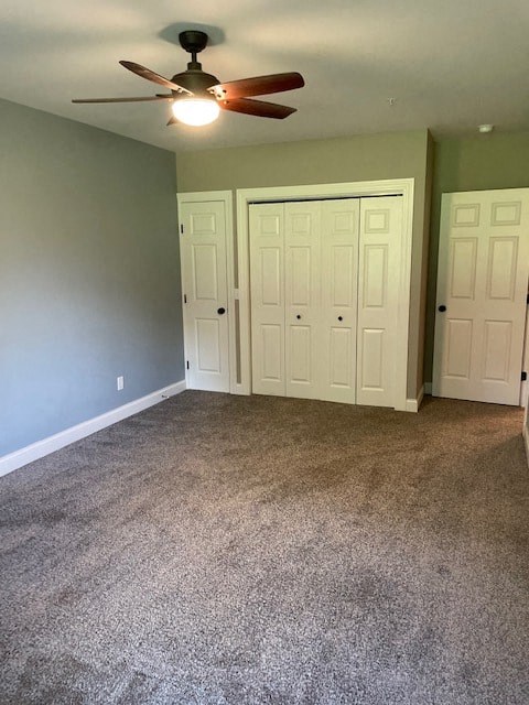 an empty living room with a ceiling fan and blue walls