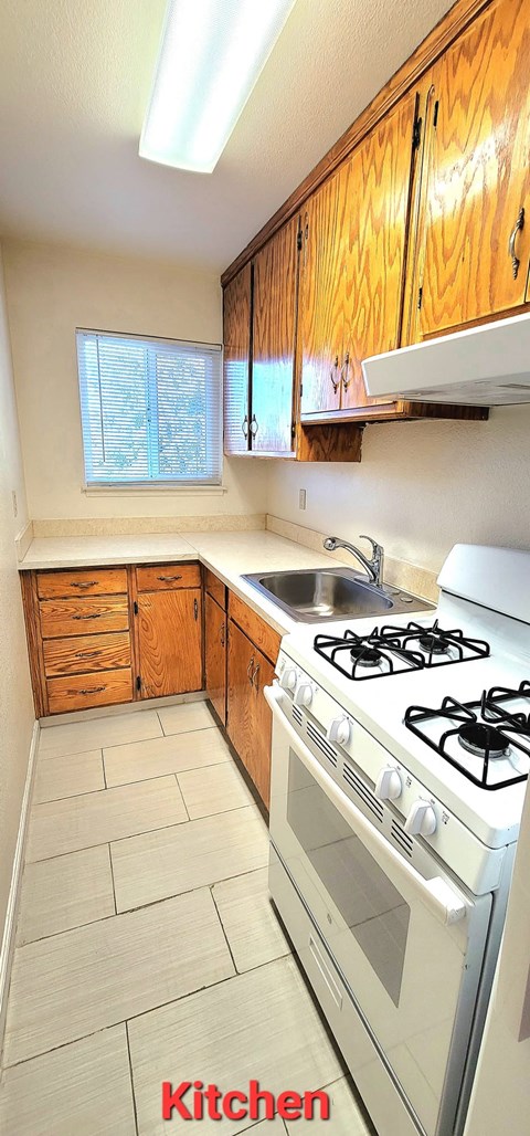 a kitchen with a stove and a sink