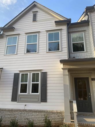 a white house with black doors and windows