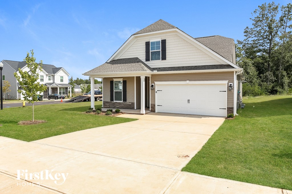 a suburban house with a driveway and a garage door