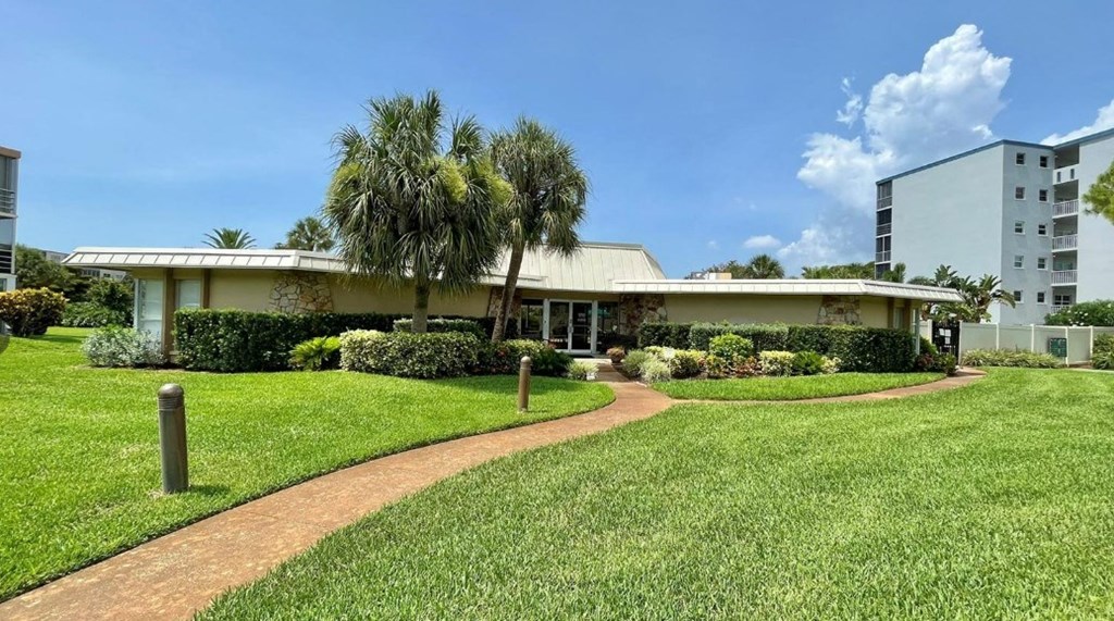 a house with palm trees in front of it