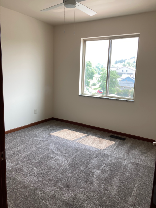 an empty room with a large window in it