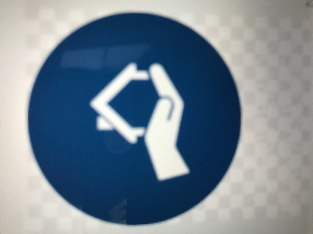 a hand pointing up in a direction sign