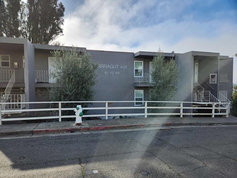 a fire hydrant in front of an apartment building