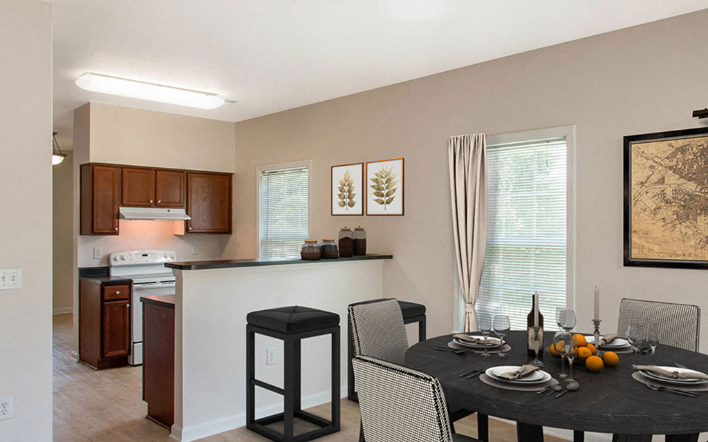 a kitchen and dining room with a table and chairs