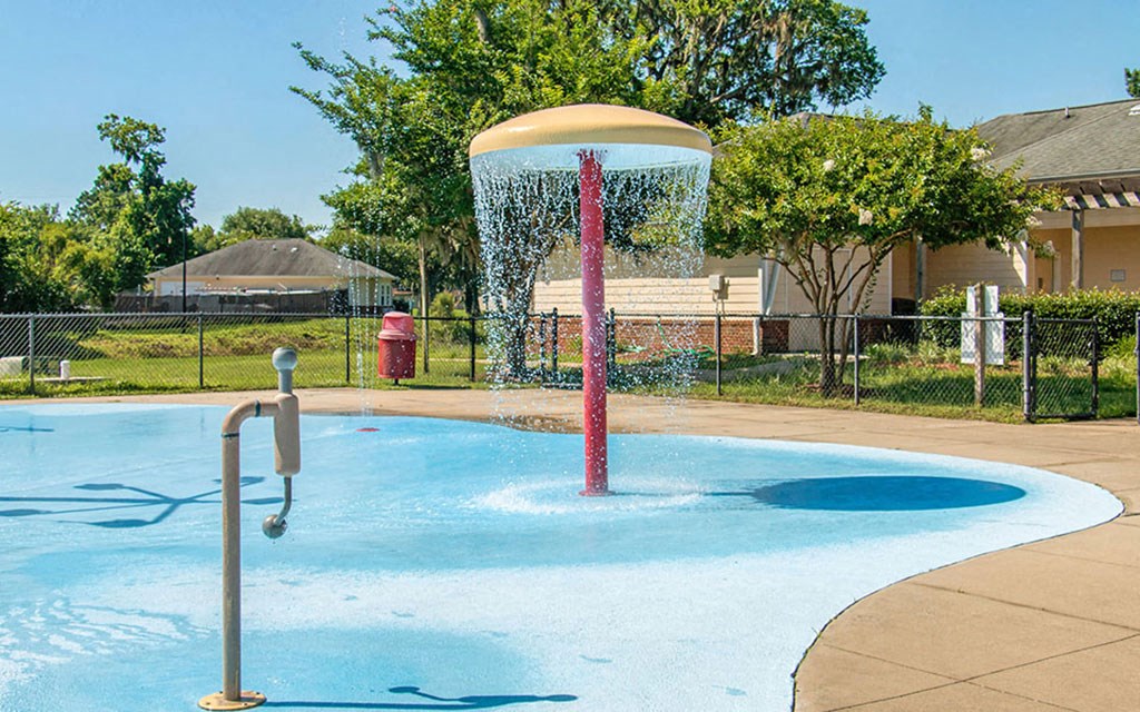 a pool with a water fountain