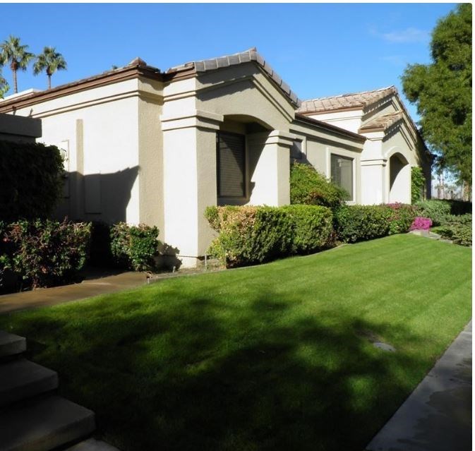a house with a lawn in front of it