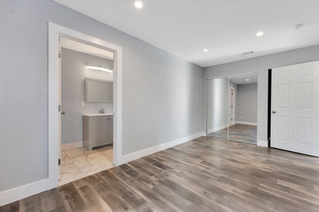 the living room is open to the bedroom and the bathroom