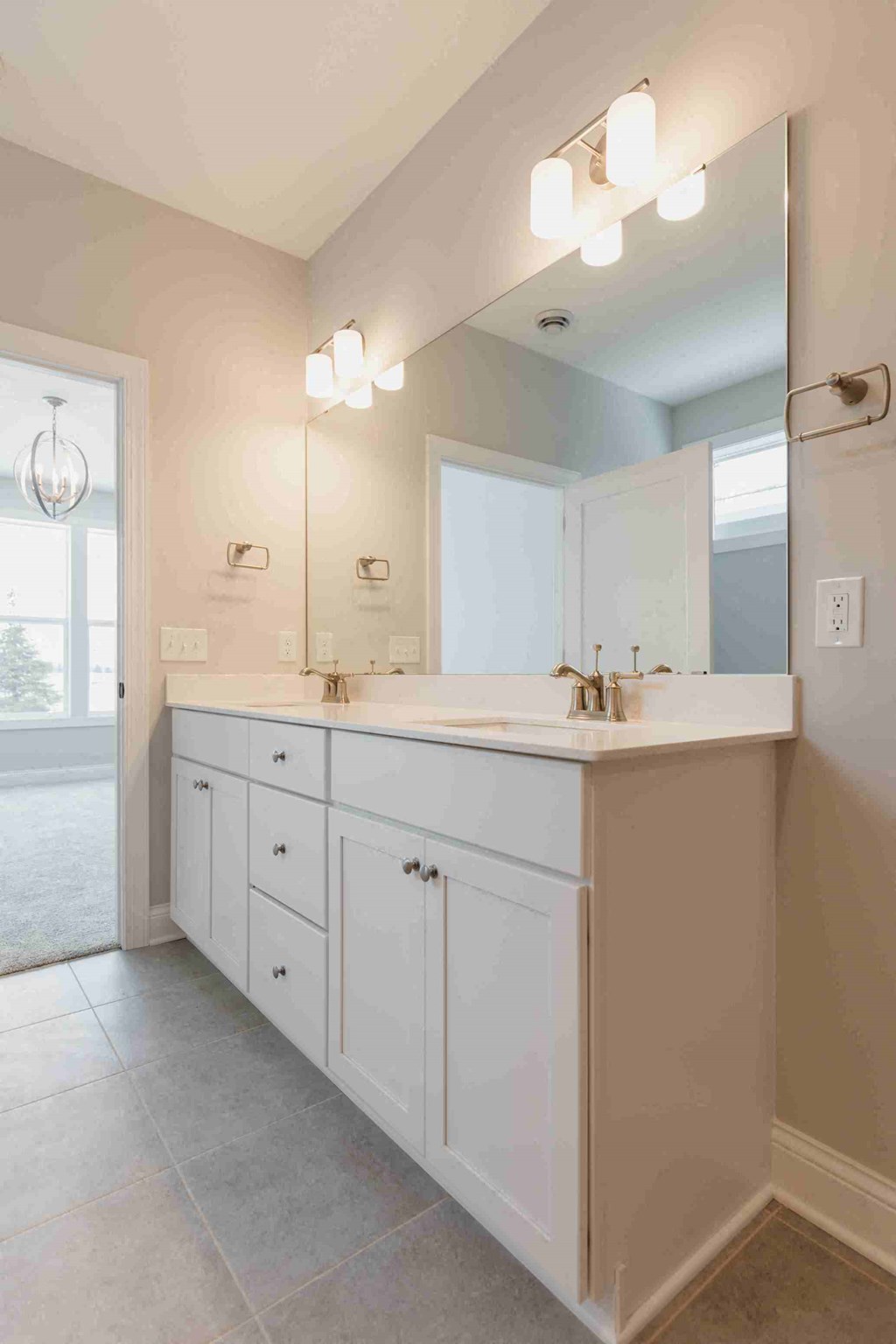 a white bathroom with a sink and a mirror
