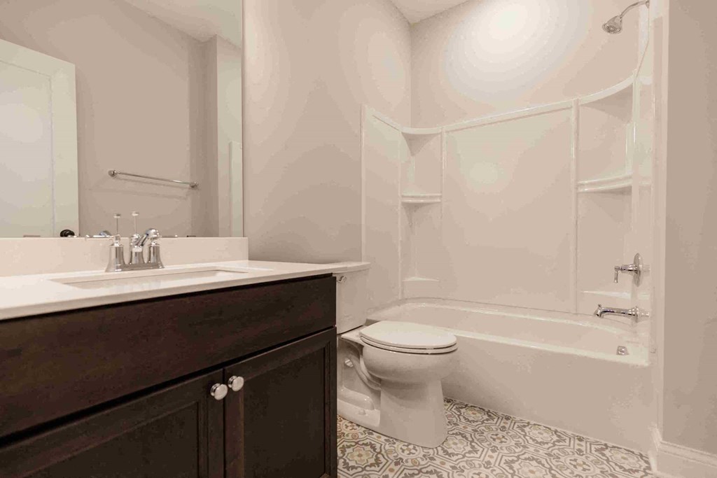 a bathroom with a sink toilet and a shower