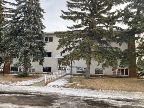 an image of an apartment building in the snow