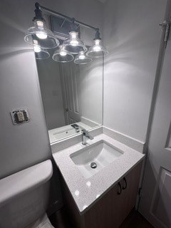 A bathroom with a sink, mirror, and lights.