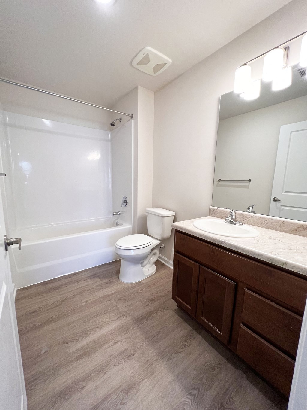 an empty bathroom with a toilet and a sink