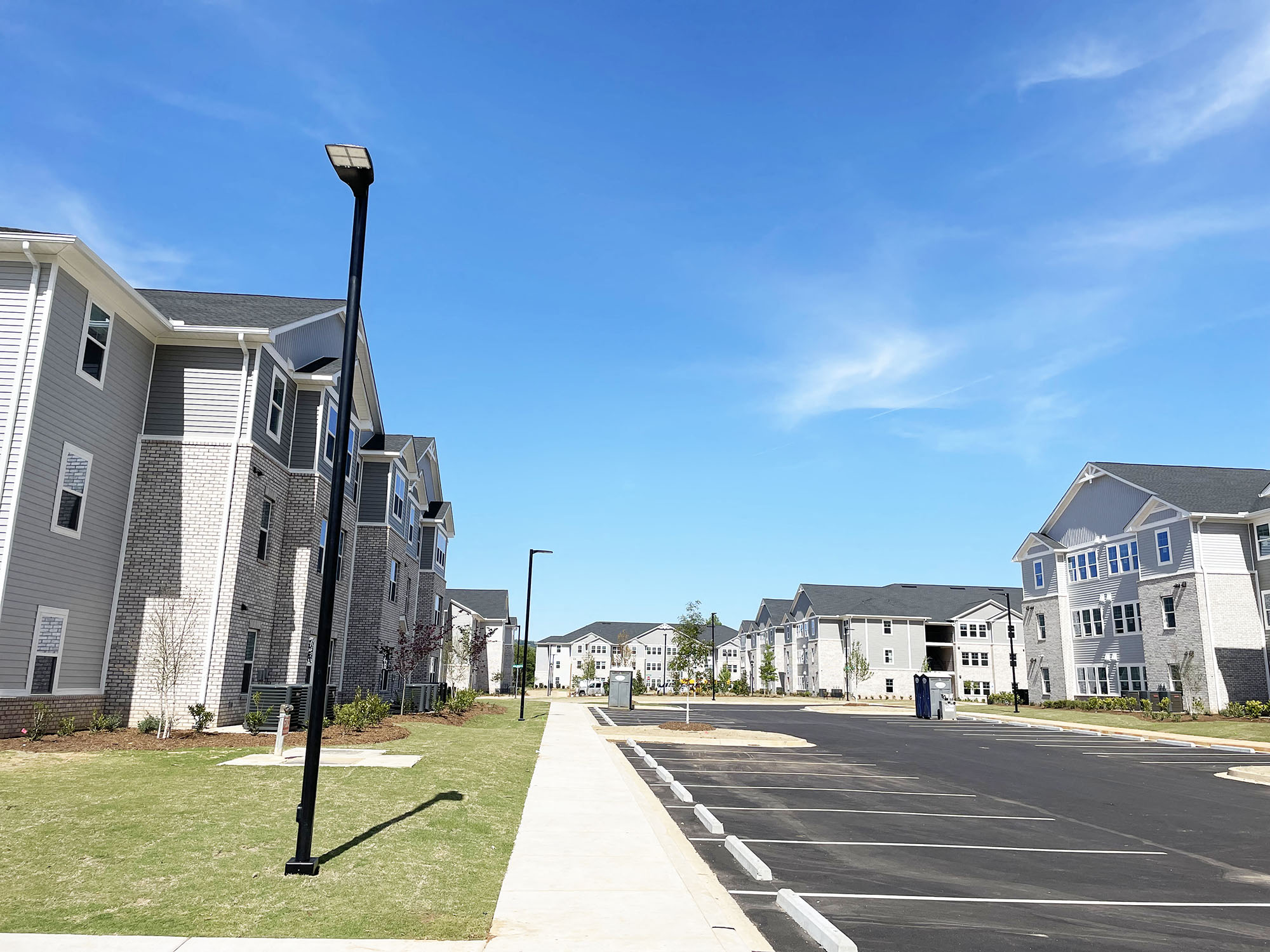a row of houses on the side of a street