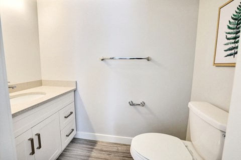 an empty bathroom with a toilet and a sink