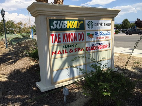 the sign for subway drive thru on the side of the road